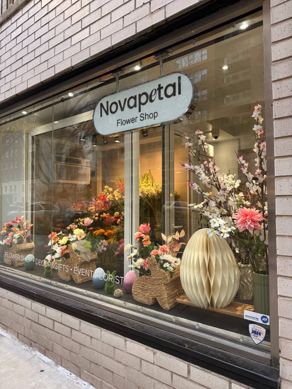 Novapetal Flower Shop storefront on East 72nd Street, Upper East Side, with a window display of seasonal flowers